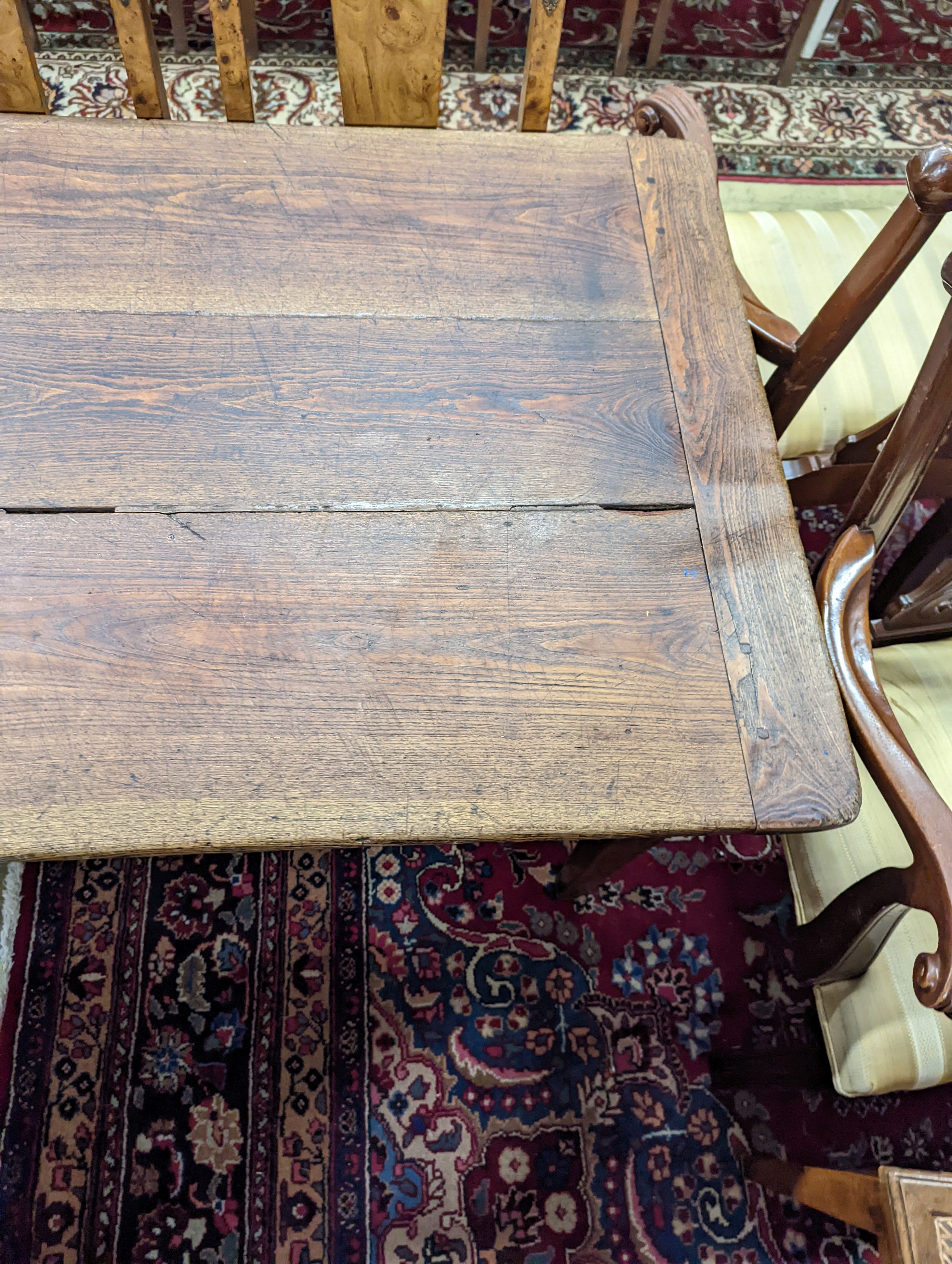 A 19th century French rectangular oak kitchen table. W-153cm, D-75cm, H-73cm.